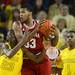 Michigan freshman Caris LeVert collides with Indiana freshman Jeremy Hollowell during the first half at Crisler Center on Sunday, March 10, 2013. Melanie Maxwell I AnnArbor.com